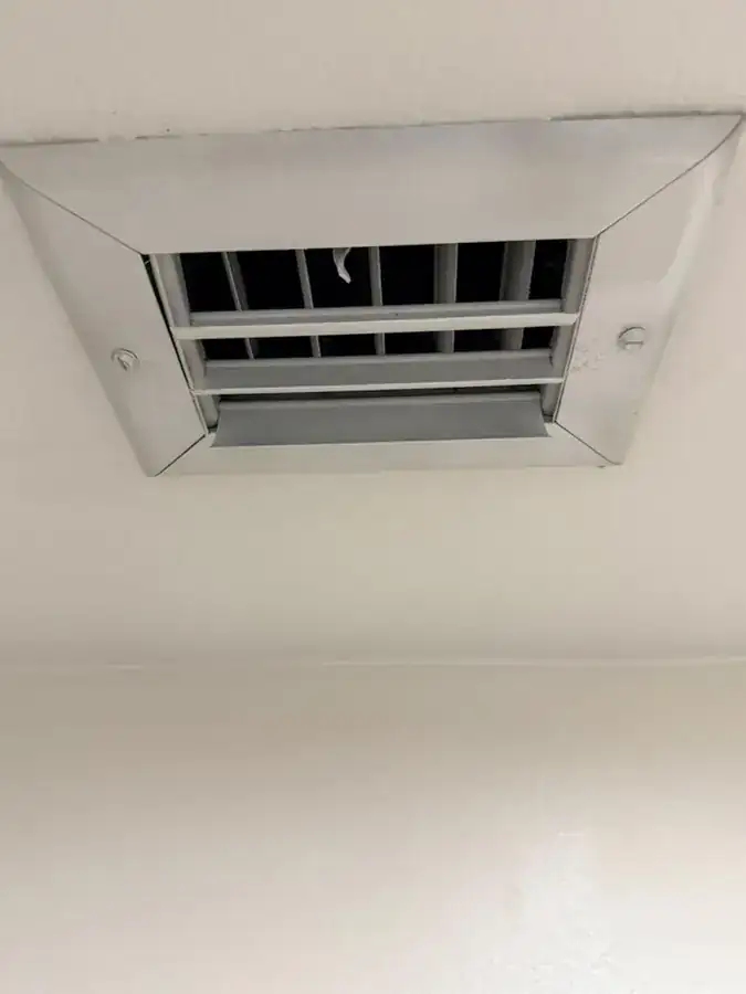 Clean AC ceiling vent after service